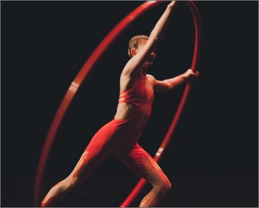 Girl in red dancing with ribbon