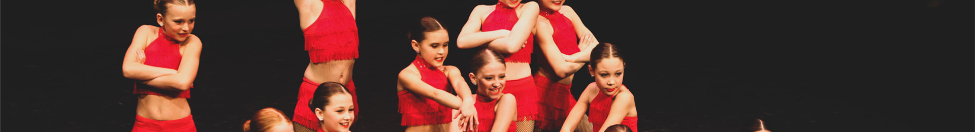 group of dancers in red